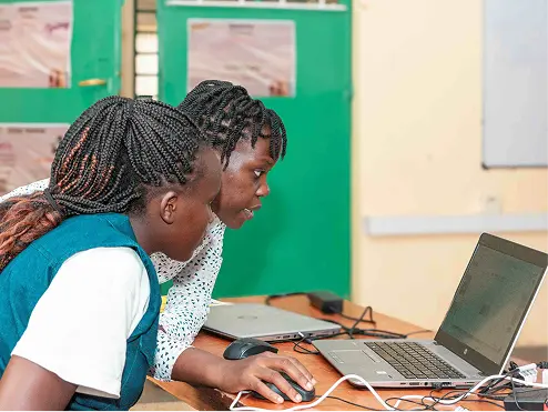 Students learning at NairoBits